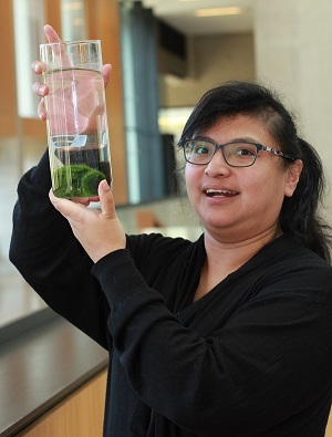 Dora Cano-Ramirez with Marimo lake balls that she conducted a side research project on while doing her PhD