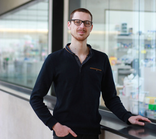Albin Tuelet pictured in SLCU building with labs in background