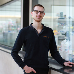 Albin Tuelet pictured in SLCU building with labs in background