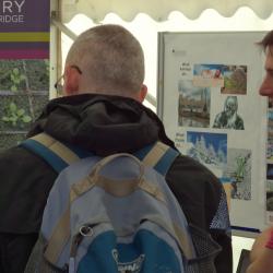 Sainsbury Laboratory postdocs talking with members of the public about plant science.