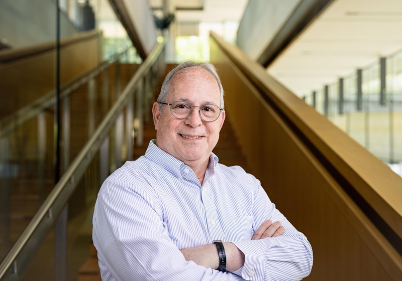 Elliot Meyerowitz standing at bottom of main internal staircase in Sainsbury Laboratory