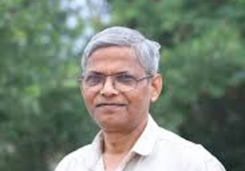 Professor Uptal Nath standing outdoors with trees in background