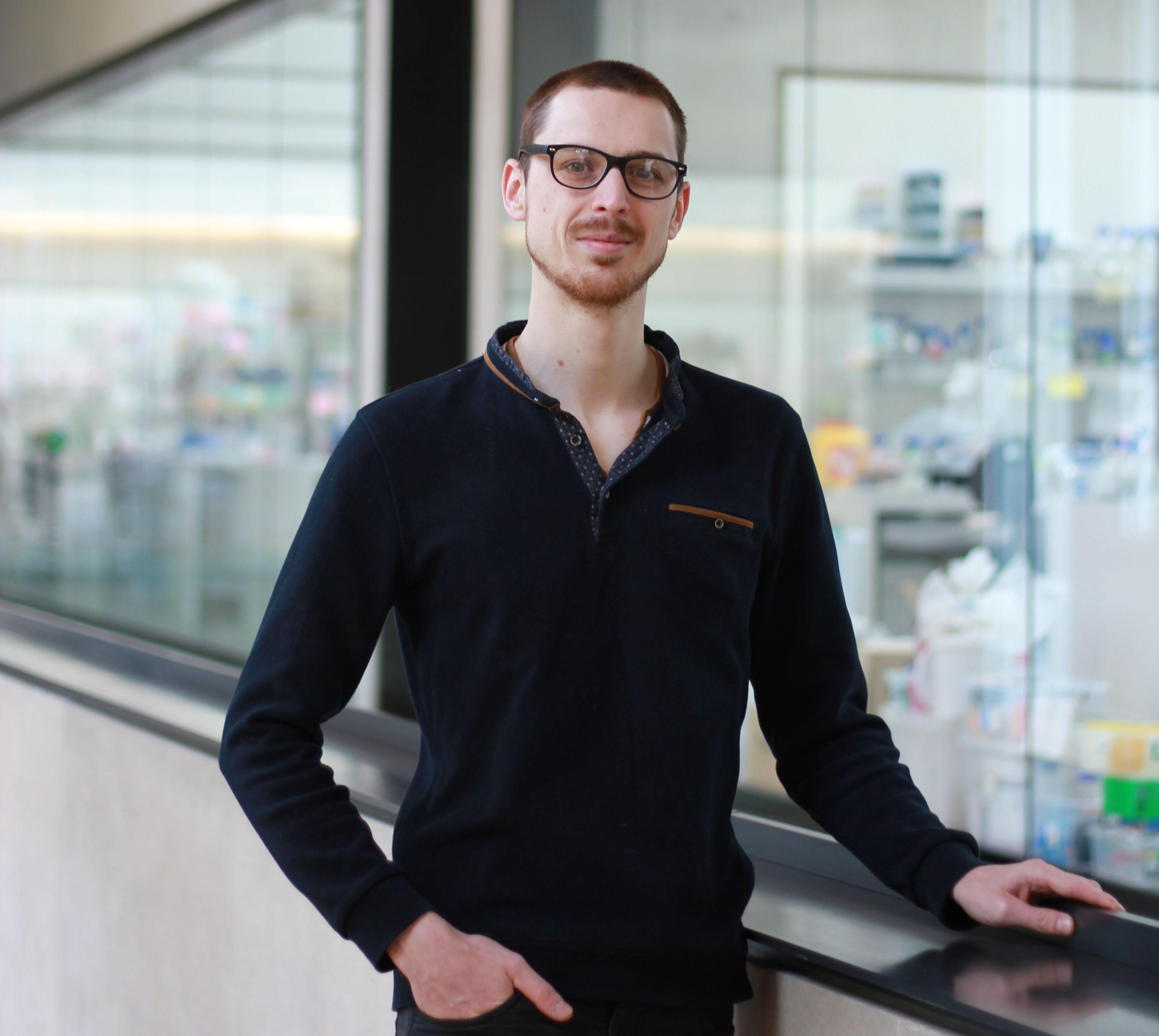 Albin Tuelet pictured in SLCU building with labs in background