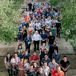 Group photo of the SLCU community at the annual SLCU Family and Staff BBQ in the Olive Tree Courtyard