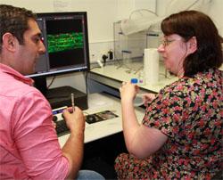 SLCU postdoc Firas Bou Daher showing Biology Teacher Catherine Russell the lab's microscopy facilities. SLCU postdoc Firas Bou Daher showing Biology Teacher Catherine Russell the lab's microscopy facilities.