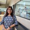 Neha Bhatia pictured in the Sainsbury Laboratory with research labs in background